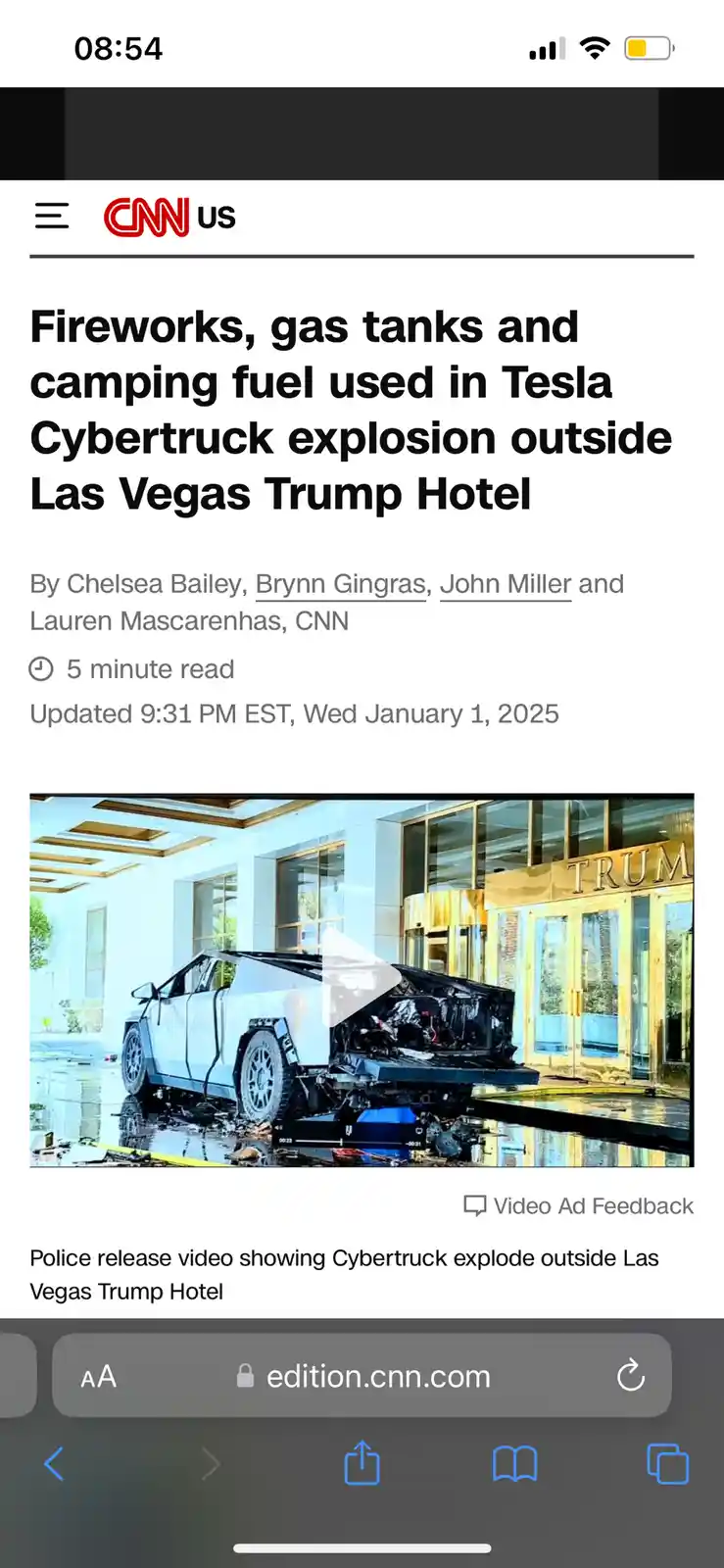 A screenshot of a CNN mobile news article shows a severely damaged white Tesla Cybertruck with its front end destroyed…