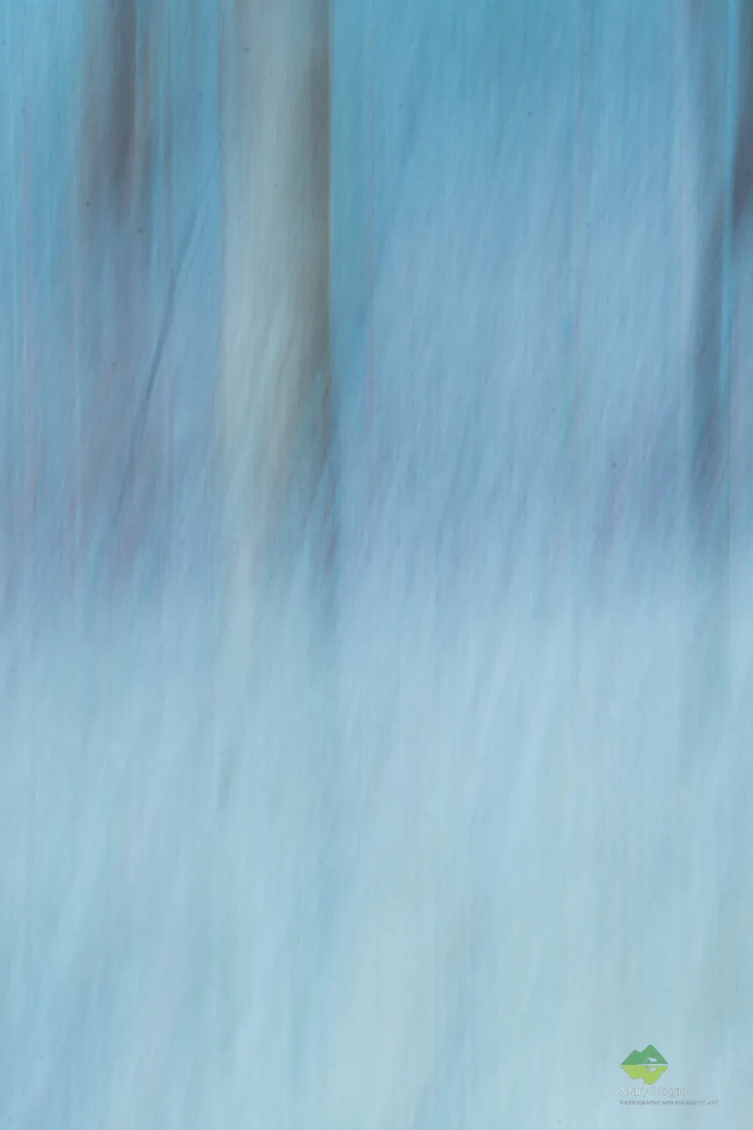 The image shows a close-up of a blue and white textured surface, resembling ice or fabric, with a watermark in the bottom…
