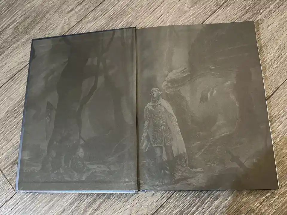 An open book displays a grayscale fantasy illustration of a knight standing in a dark, misty forest with a large dragon…