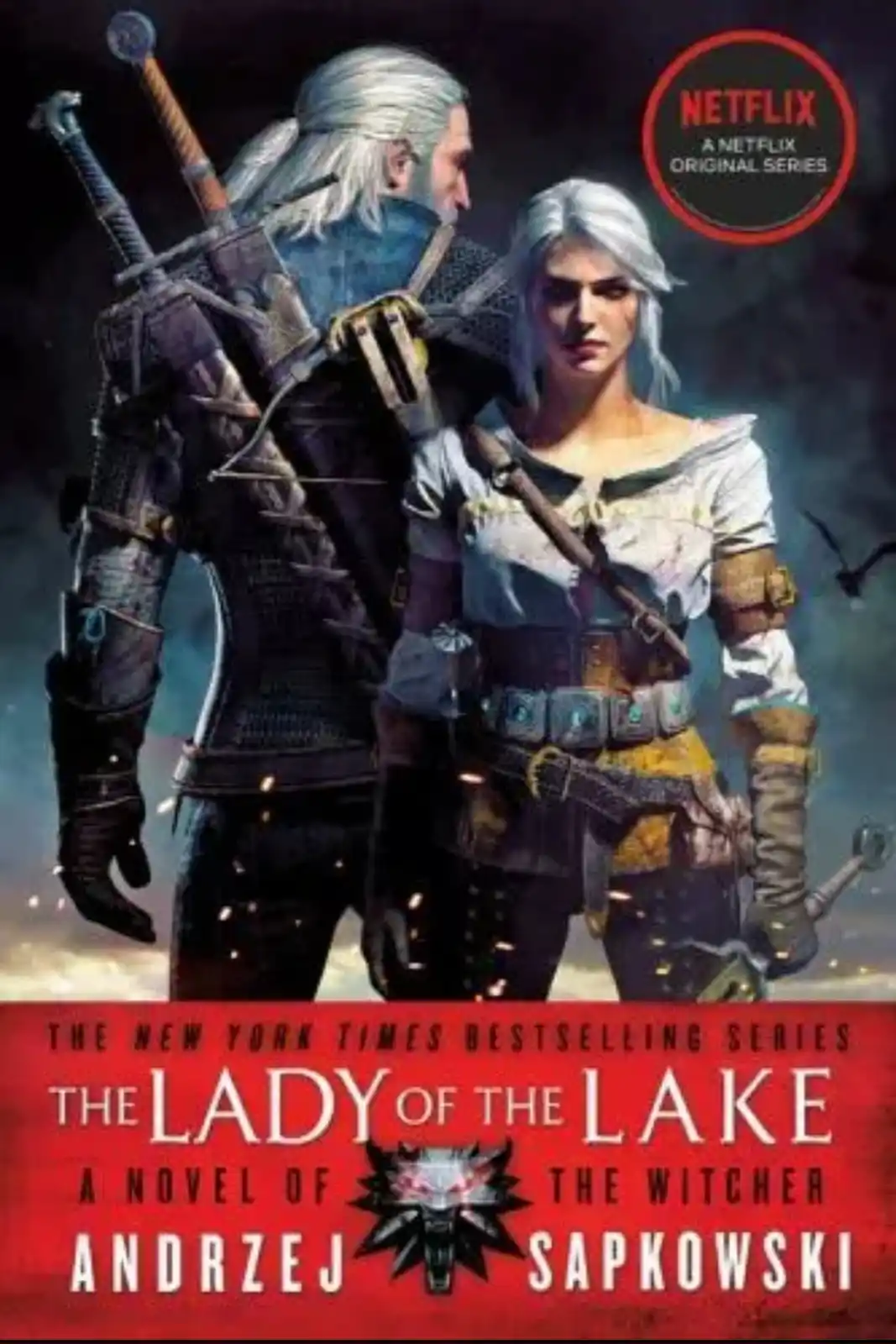 The image is a book cover for 'The Lady of the Lake' by Andrzej Sapkowski, featuring two characters with white hair and…