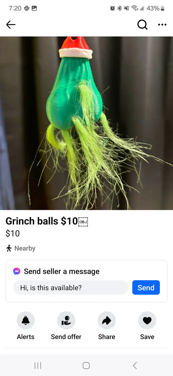 A close-up image of a green, bulbous fishing lure with a red Santa hat and green fuzzy fibers, displayed as a $10 item for…