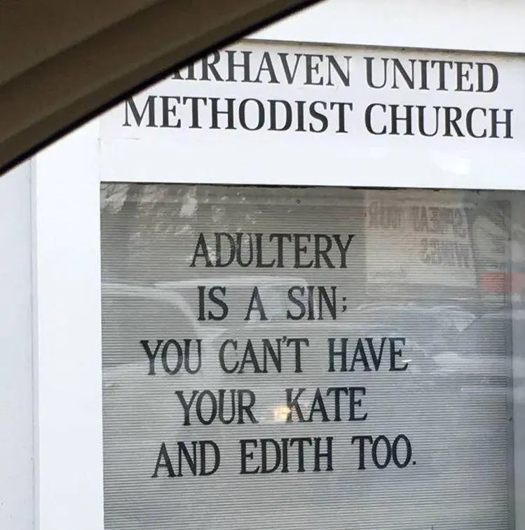 A sign on the window of Airhaven United Methodist Church reads 'ADULTERY IS A SIN: YOU CAN'T HAVE YOUR KATE AND EDITH TOO.'…