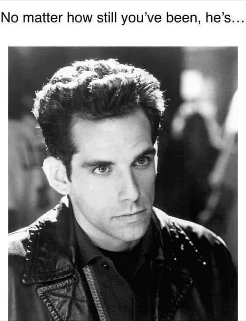 A black and white photo of actor Ben Stiller with a serious, intense stare, wearing a leather jacket. The text at the top…