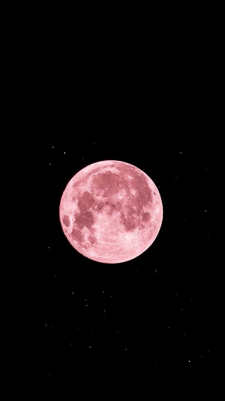 A large, pink-hued full moon dominates a black sky speckled with faint stars. Overlaid text reads 'i'm not crying, you're…