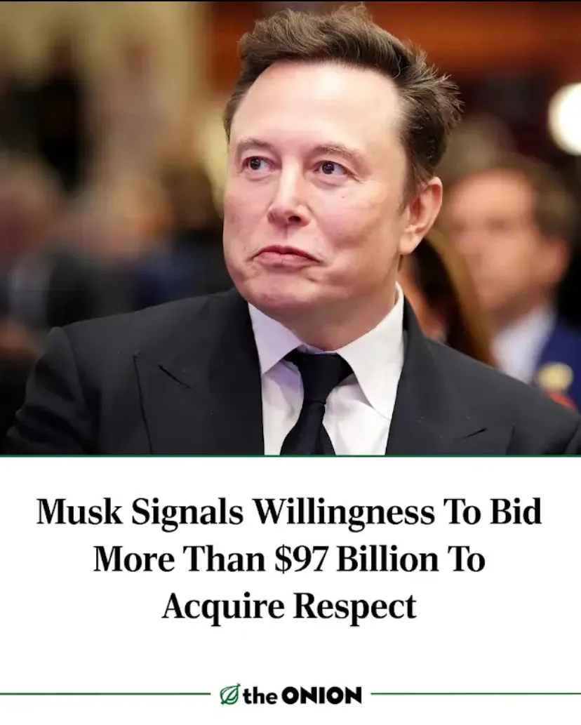 A photo of Elon Musk in a black suit and tie, looking upward with a skeptical or unimpressed expression. Overlaid text reads…