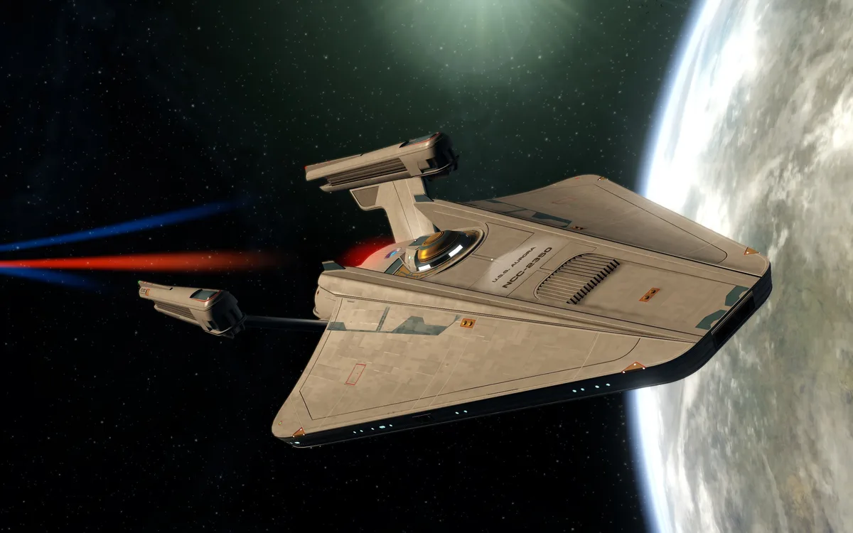 A gray starship with 'U.S.S. Aurora NCC-2350' written on its side is shown in space, firing red and blue beams from its…