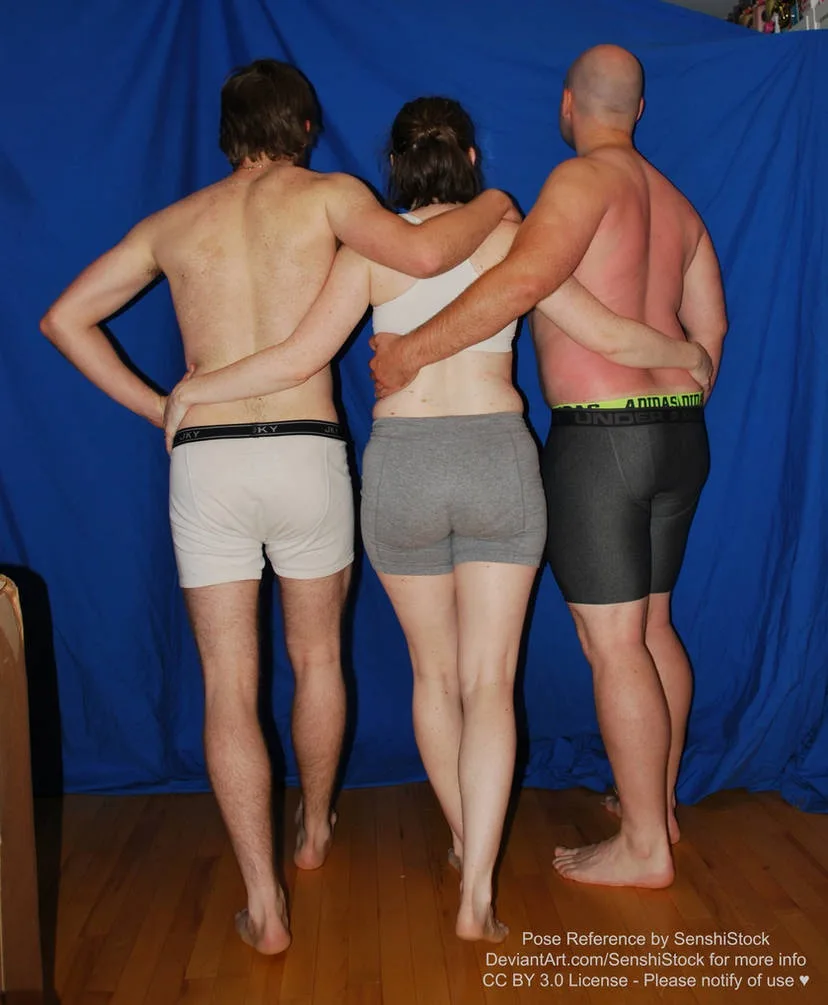 Three people stand back-to-back in underwear against a blue backdrop, arms draped over each other's shoulders in a pose…