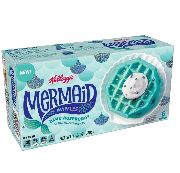 A box of Kellogg's Mermaid Waffles, blue raspberry flavored, featuring a teal waffle with white cream and glitter on a…
