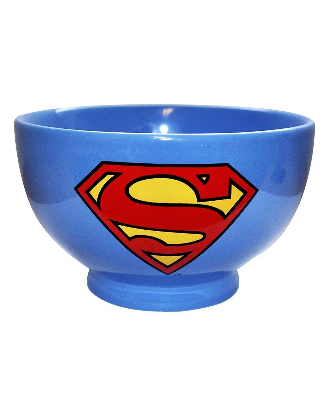 A glossy blue ceramic bowl features the iconic red and yellow Superman logo prominently on its side, set against a plain…