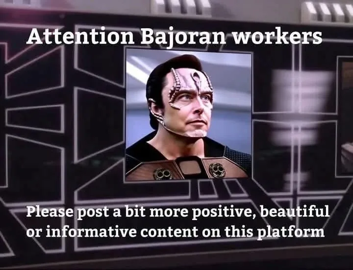 A screenshot of a Star Trek: Deep Space Nine scene shows a Bajoran official on a screen with overlaid text. The text reads…