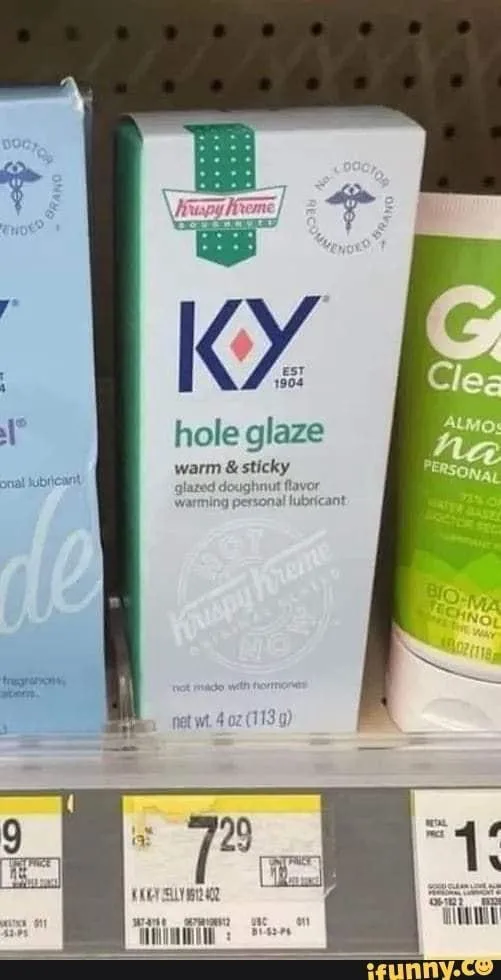 A store shelf displays personal lubricant products, including a central white box of 'KY hole glaze' with a playful…