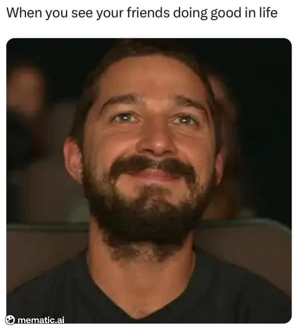 A man with a beard and mustache looks upward with a smug, satisfied smile while seated in a dimly lit environment. The…