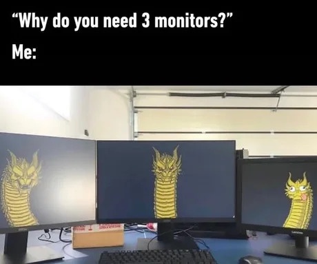 Three computer monitors arranged side-by-side on a desk, each displaying a different stage of a cartoonish yellow dragon's…