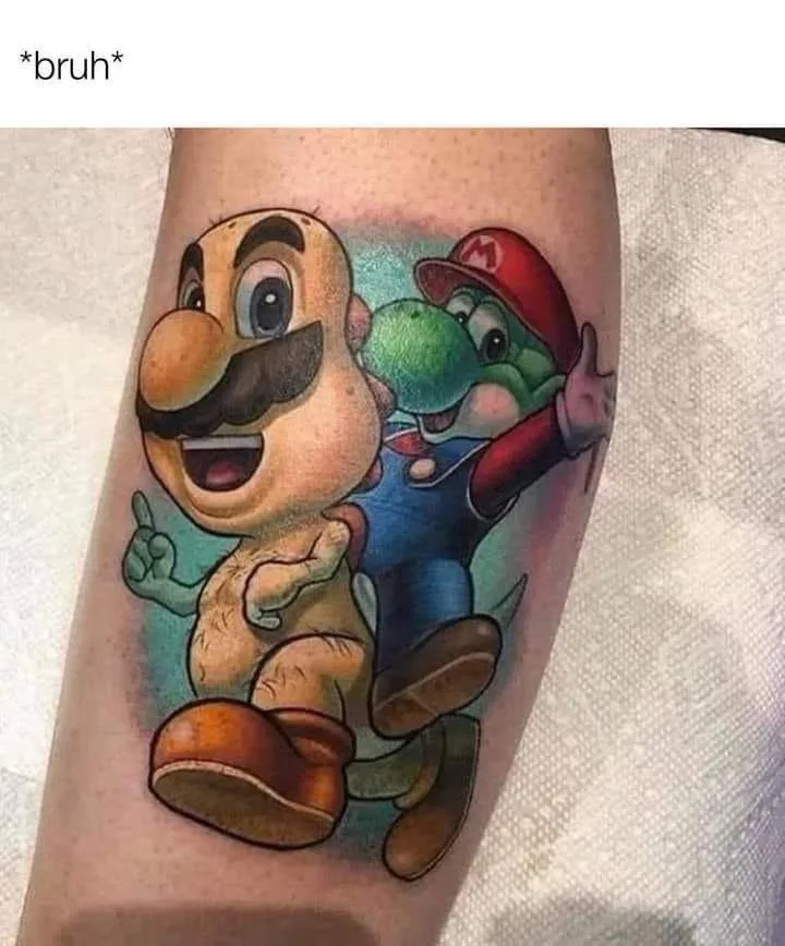 A tattoo on a person's forearm depicts a large, cartoonish, bald, mustachioed character resembling Mario, but with a green…