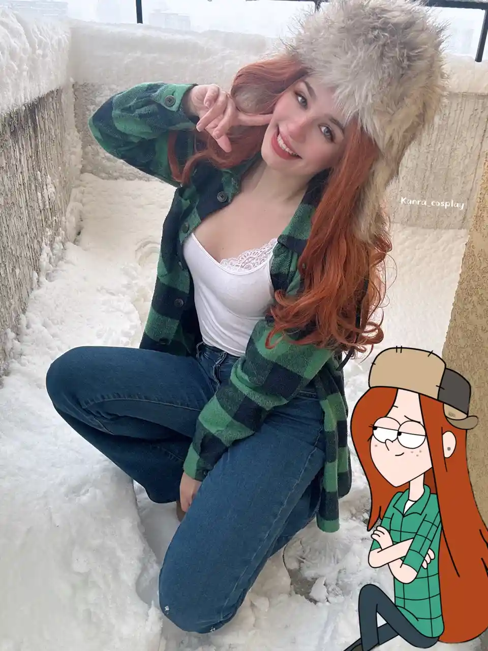 A woman with red hair wearing a fur hat, green plaid shirt, and jeans poses cheerfully in deep snow. Beside her is a cartoon…