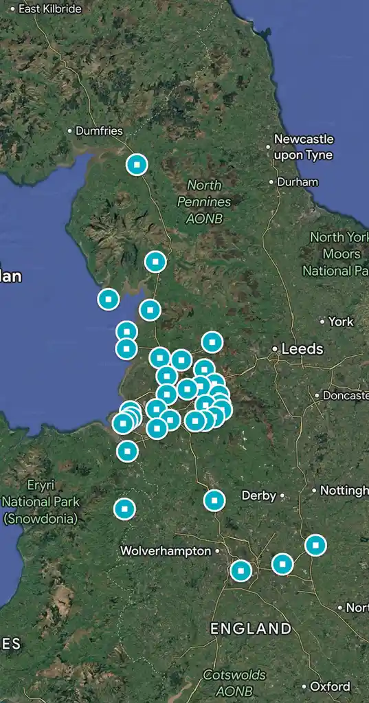A satellite map of northern England and southern Scotland shows numerous teal circular markers clustered densely in the…