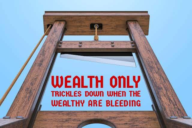 A low-angle shot of a wooden guillotine against a clear blue sky, with red text overlaid that reads 'WEALTH ONLY TRICKLES…