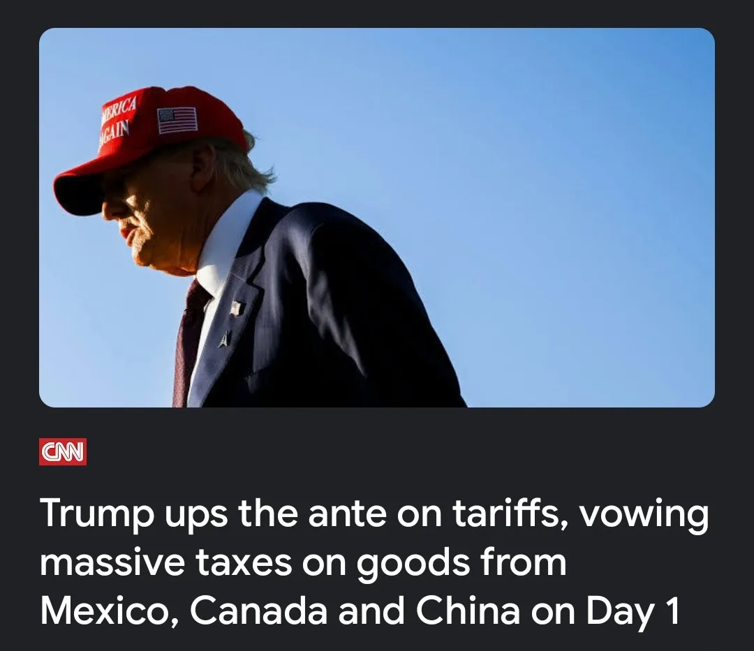 A low-angle photo shows Donald Trump in profile, wearing a red 'Make America Great Again' cap and a dark suit against a…