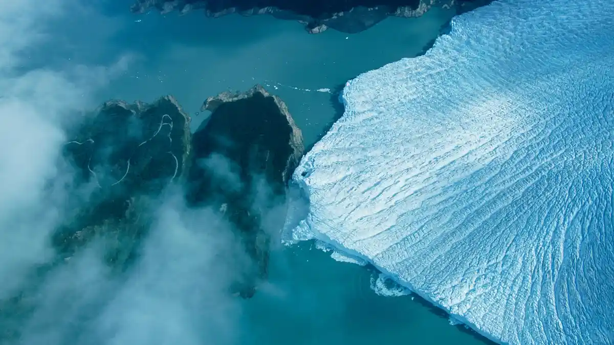 A giant glacier rises 240 feet above Argentino Lake, measuring three miles long. This is just the tip of a 100-square-mile…