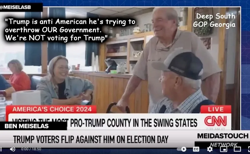 A screenshot from a CNN news segment shows an older man in a light shirt standing and smiling while another older man in a…