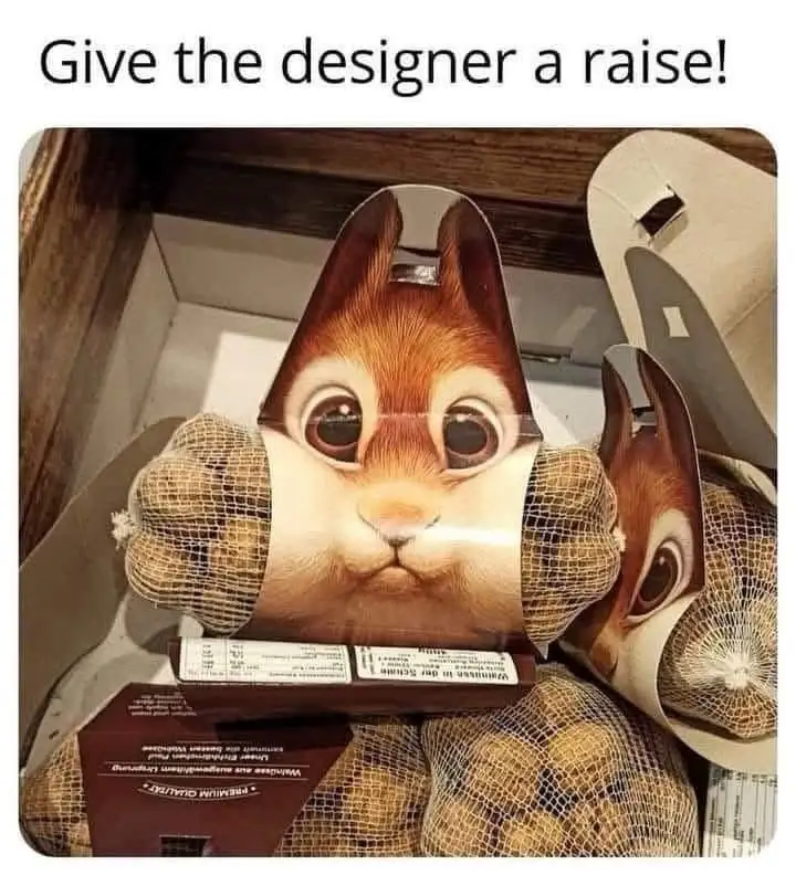 A close-up photo shows a cardboard chipmunk costume head with large, expressive eyes and a cute face, nestled inside a…