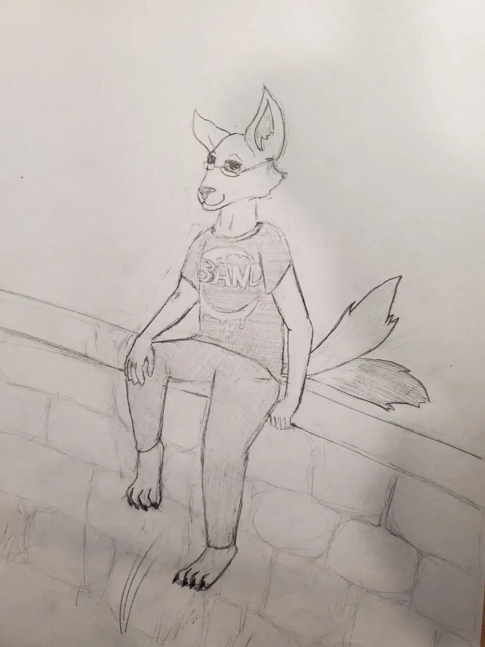 A pencil sketch of an anthropomorphic fox wearing glasses and a t-shirt with 'BAND' printed on it, sitting on a stone ledge…