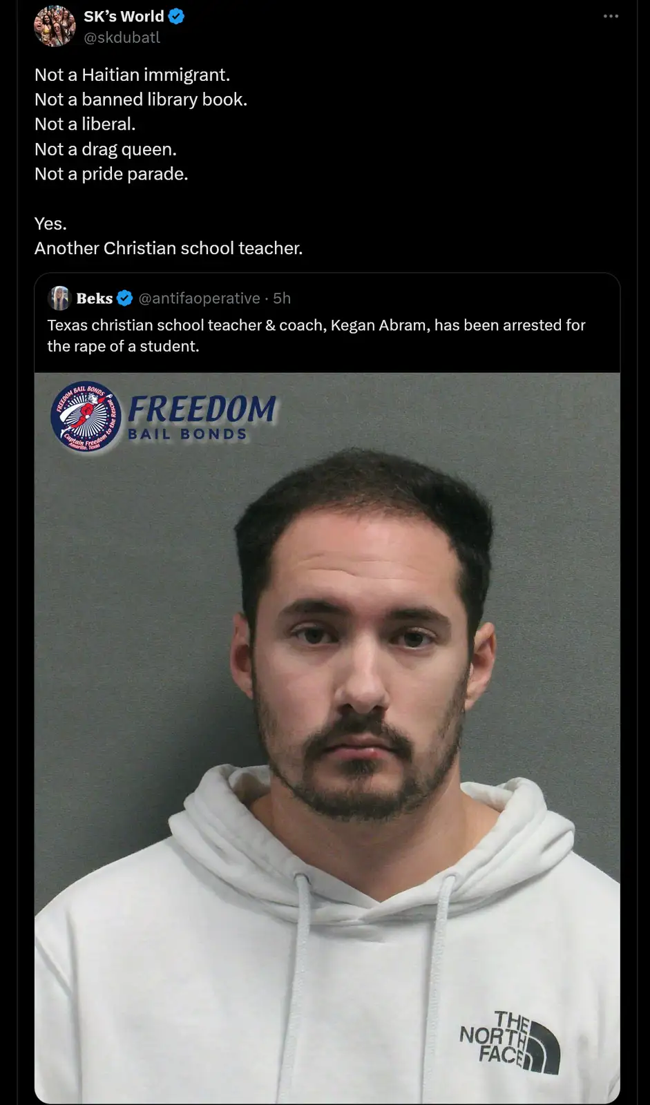 A mugshot of a man in a white The North Face hoodie, with overlaid text listing things he is not, culminating in 'Yes…