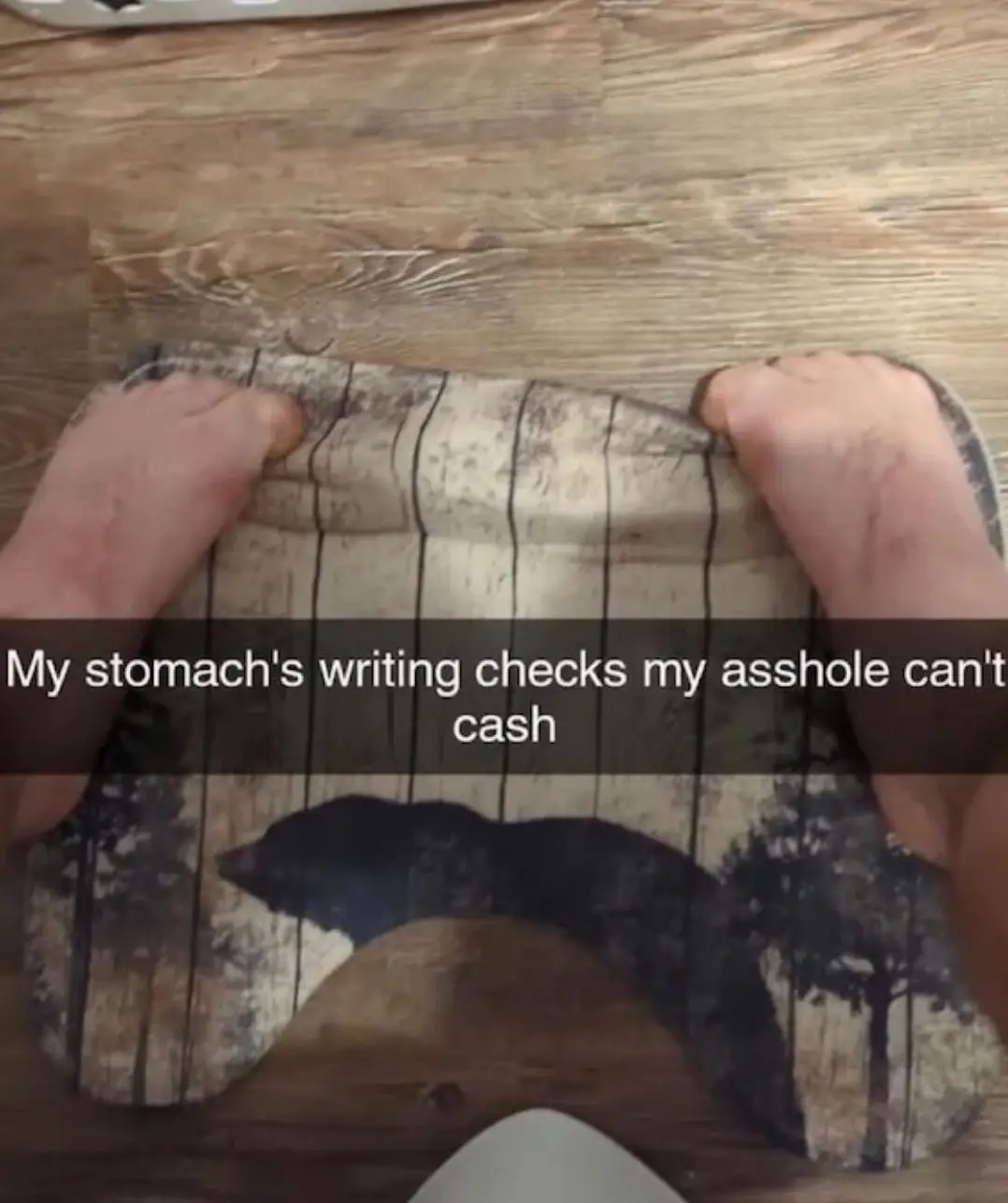 Two bare feet press down on a patterned cloth with a bear silhouette, overlaid with the text 'My stomach's writing checks my…