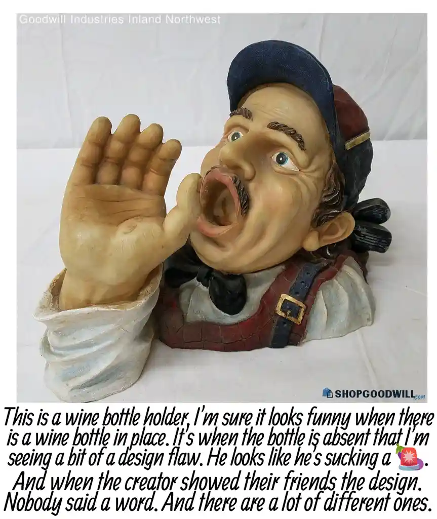 A figurine of a man with a large open mouth and raised hand, designed as a wine bottle holder, is shown without a bottle…