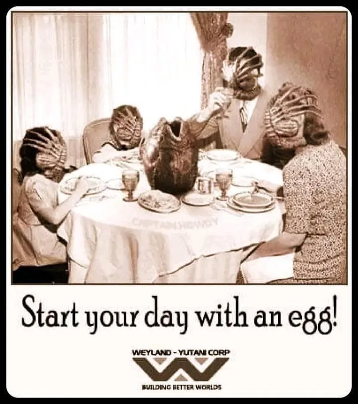 A sepia-toned image shows four people, all wearing Predator masks, seated around a dining table with plates and glasses. One…
