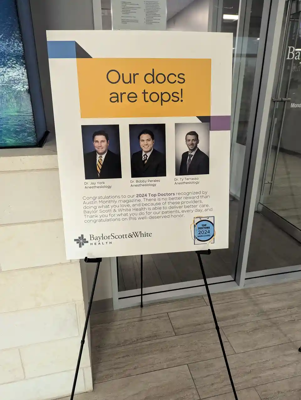 A hospital sign celebrates three anesthesiologists named Dr. Jay York, Dr. Bobby Perales, and Dr. Ty Terrasso as '2024 Top…