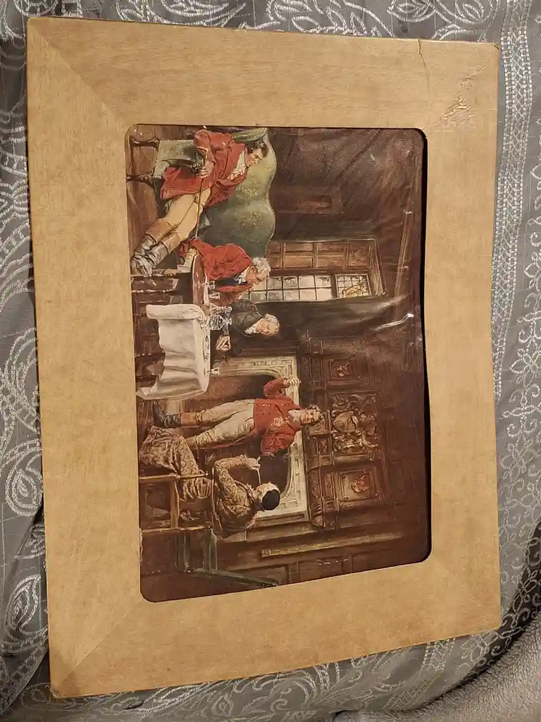 A framed vintage illustration depicts four men in 18th-century attire in a room, with one man reclining on a chair, another…