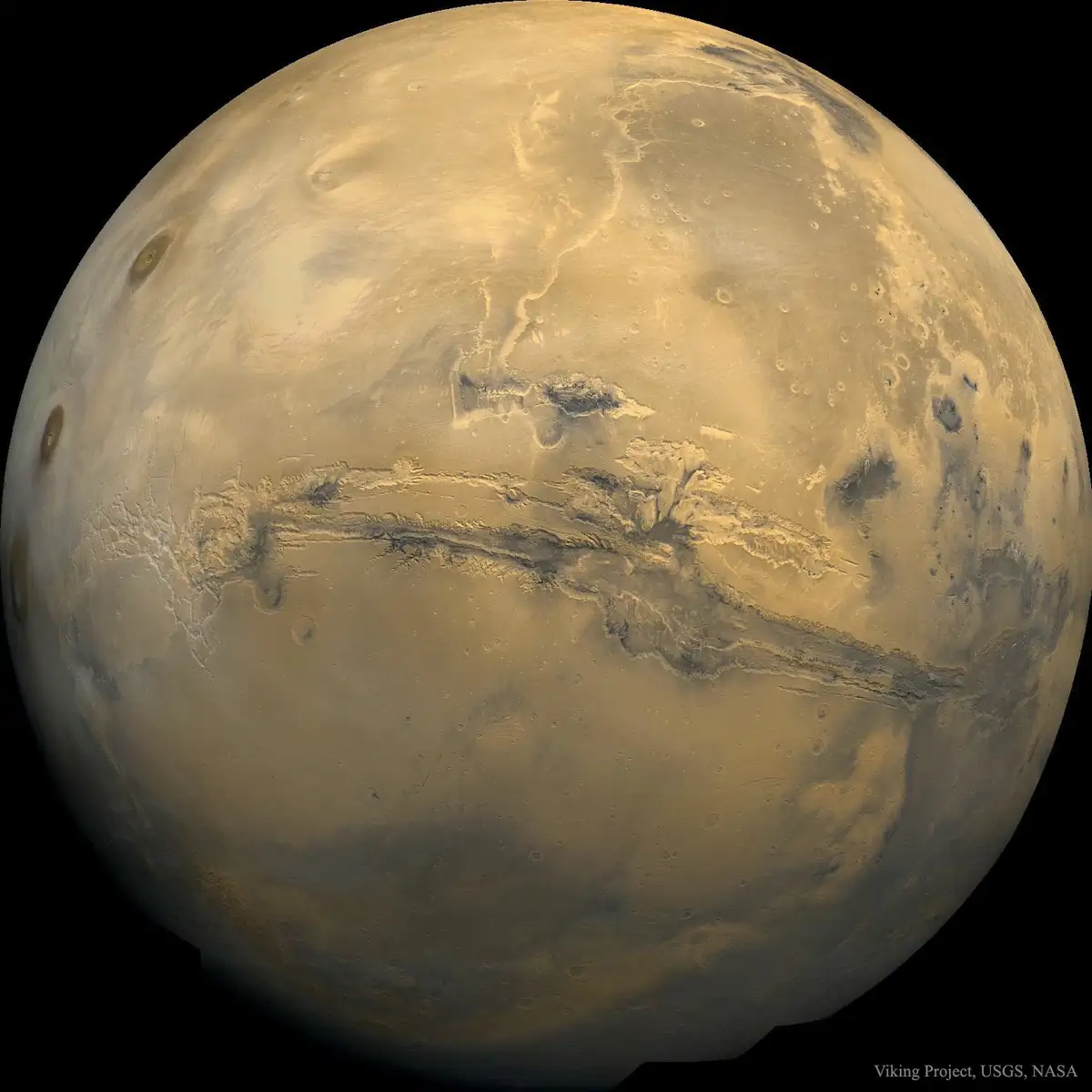 a full view of the planet mars, showing its reddish-brown surface with visible craters and geological features. overlaid…