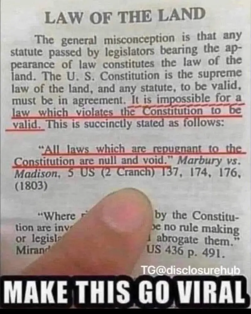 A close-up image shows a finger pointing at a printed text titled 'LAW OF THE LAND'. The text explains that laws violating…