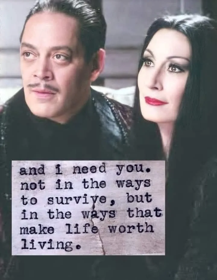 A still image from the 1964 film 'The Addams Family' featuring the characters Gomez and Morticia Addams. The image shows…