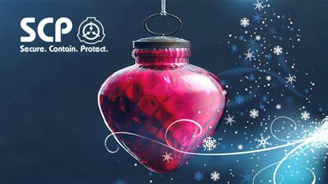 A glossy red heart-shaped Christmas ornament hangs by a string against a dark blue background with snowflakes and light…