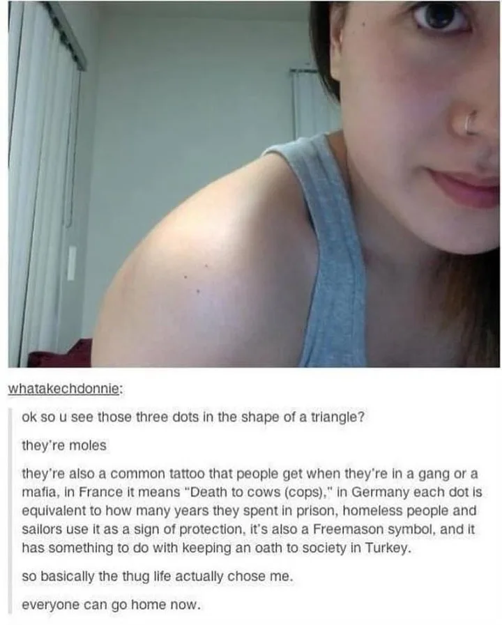 A close-up photo of a person's shoulder showing three small moles arranged in a triangle. Overlaid text humorously explains…