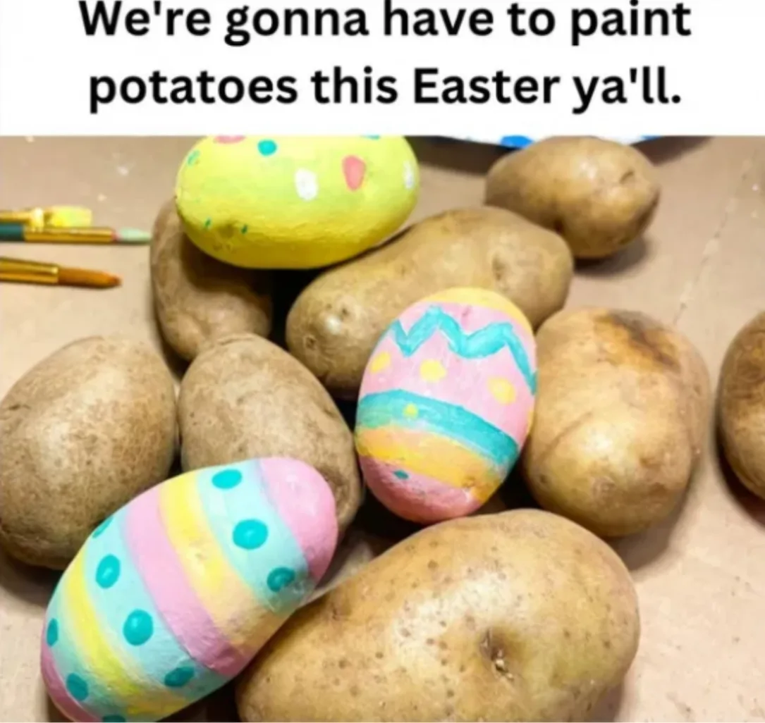 A pile of potatoes, some of which are painted to resemble Easter eggs with colorful patterns, sits on a brown surface with…
