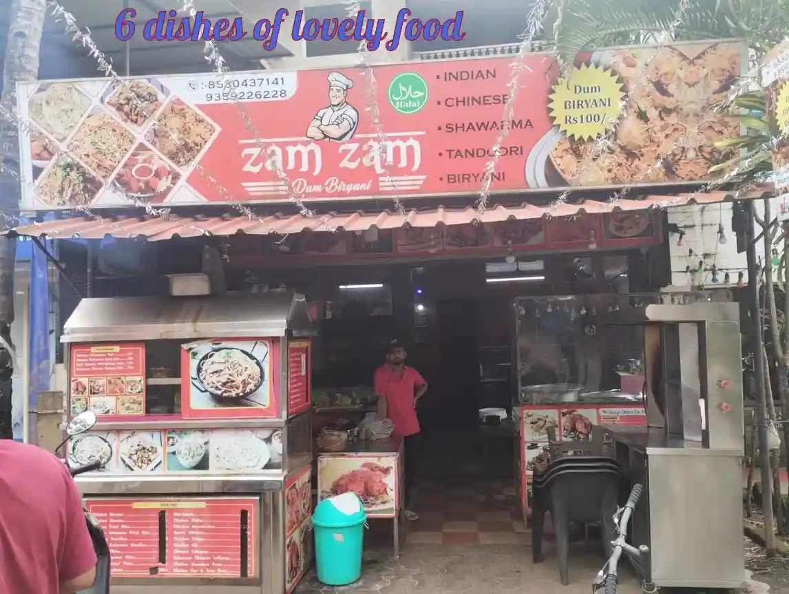 An outdoor Indian street food stall named 'Zam Zam Dum Biryani' with a red signboard listing Indian, Chinese, Shawarma…