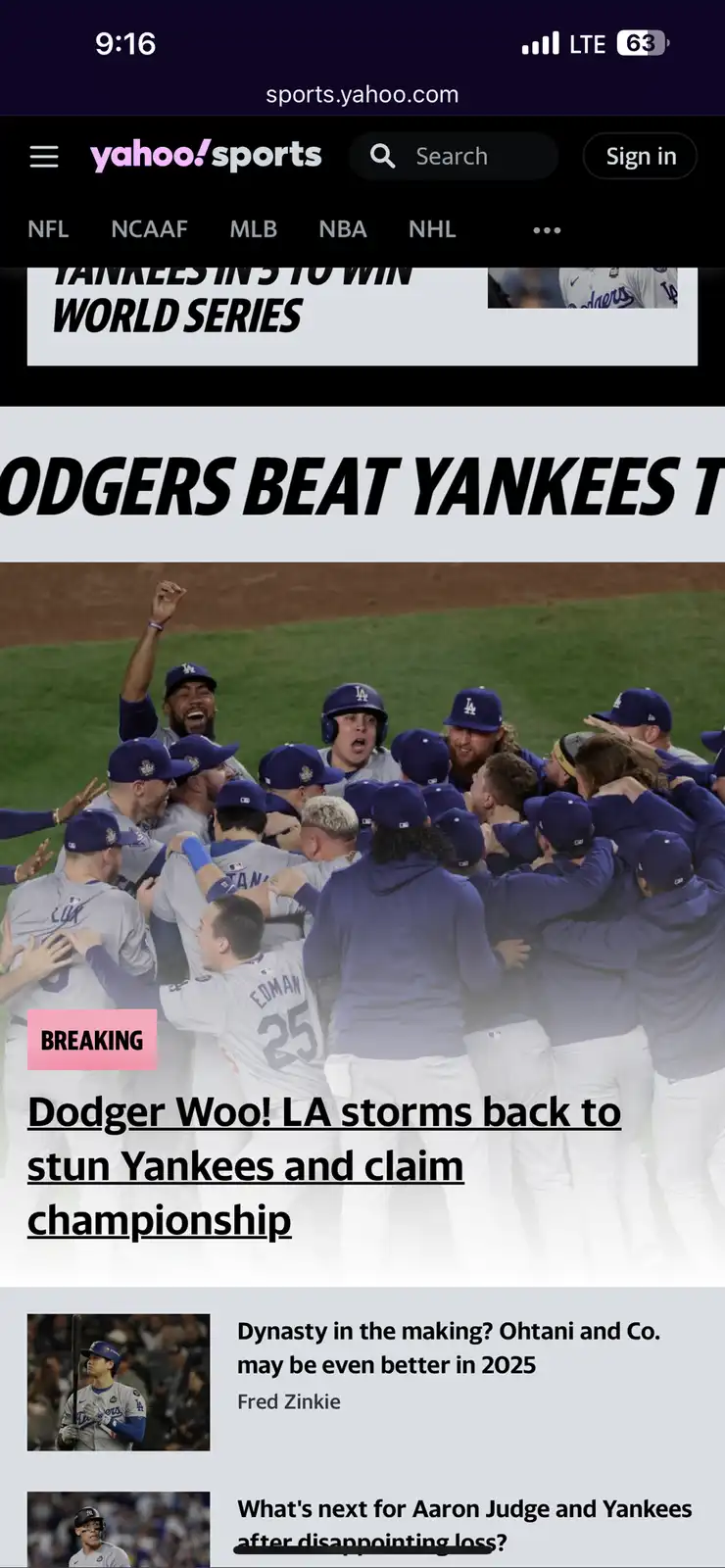 A screenshot of a Yahoo Sports article shows a jubilant Los Angeles Dodgers baseball team huddled together in celebration on…