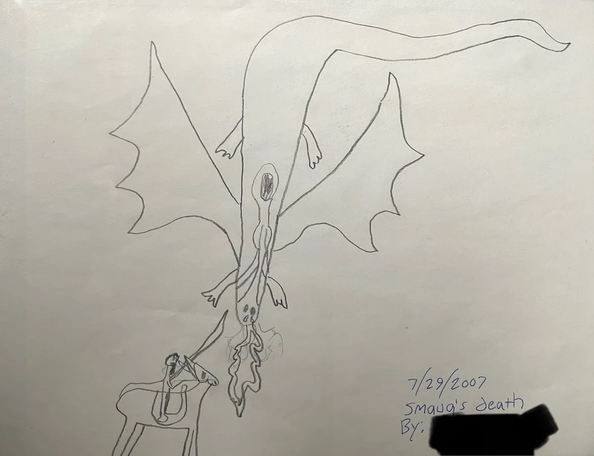 A child's pencil drawing shows a large dragon with bat-like wings and a long tail, its head being impaled by a spear held by…