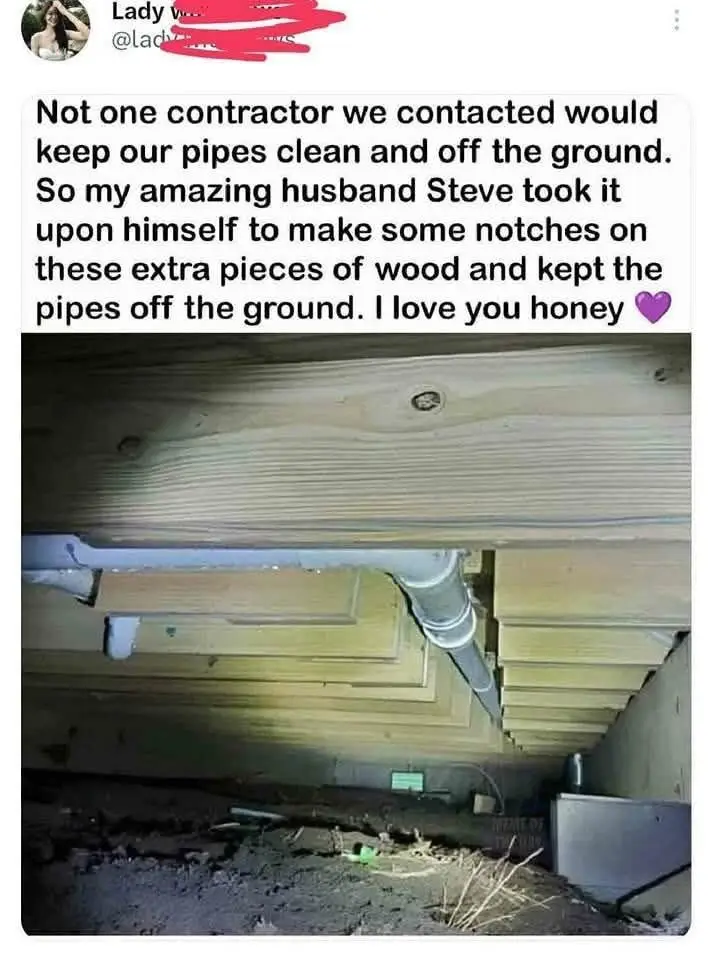 A screenshot of a social media post showing a photo of pipes resting on homemade wooden notches under a floor. The overlaid…