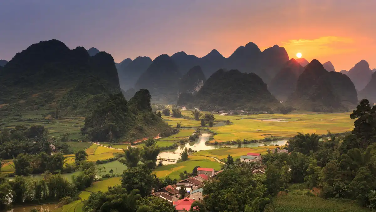As sunset's warm glow descends, Cao Bang's valleys burst into vibrant hues, emerald forests and terracotta villages set…