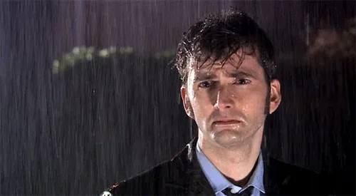 five panels show actor david tennant as the doctor standing in the rain, his expression progressively shifting from neutral…