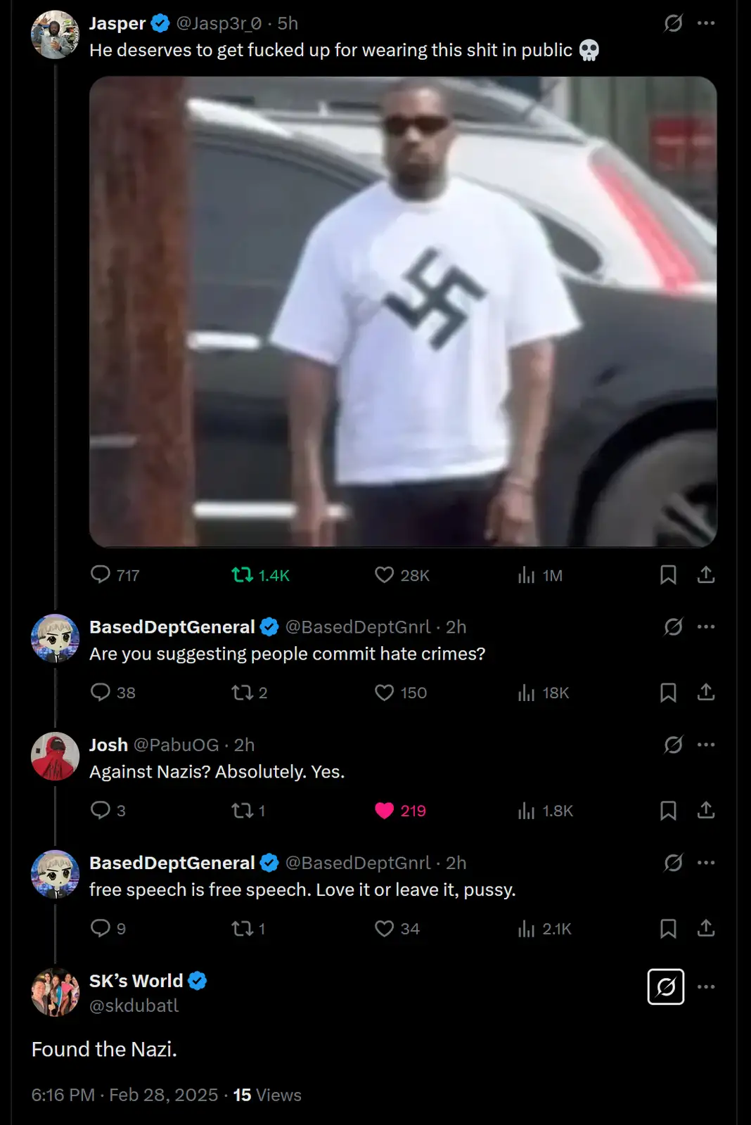 A blurry image shows a man wearing a white t-shirt with a black swastika printed on the front, standing outdoors near a car…