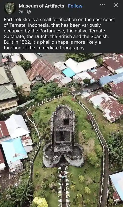 An aerial photo shows the ruins of Fort Tolukko in Indonesia, a stone structure with a distinct phallic shape, surrounded by…