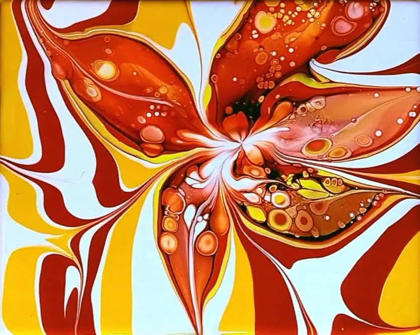 An abstract, swirling painting resembling a flower with vibrant orange, yellow, and white colors and bubble-like textures…