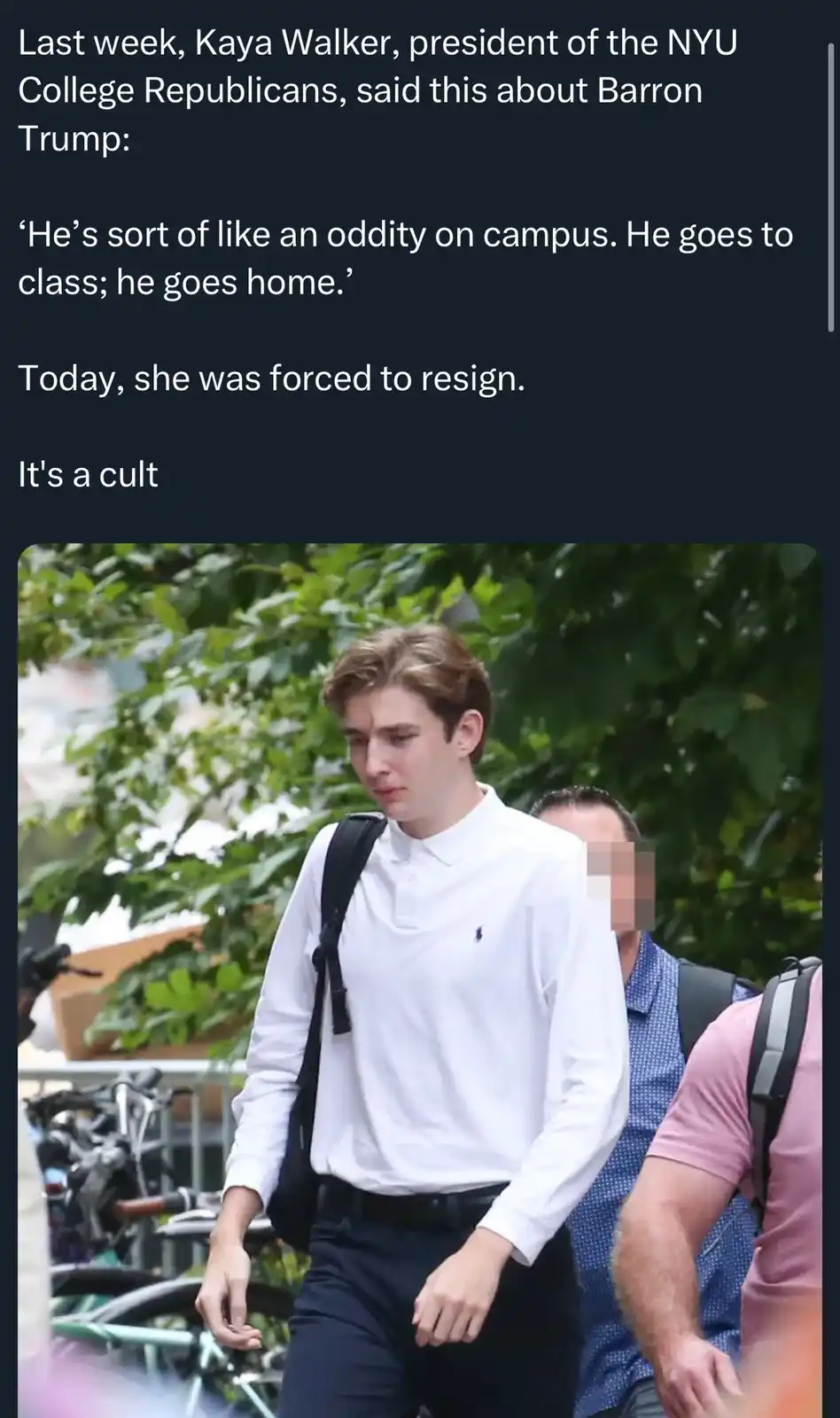 The image shows a young man with light brown hair wearing a white long-sleeved polo shirt with a small blue logo on the left…