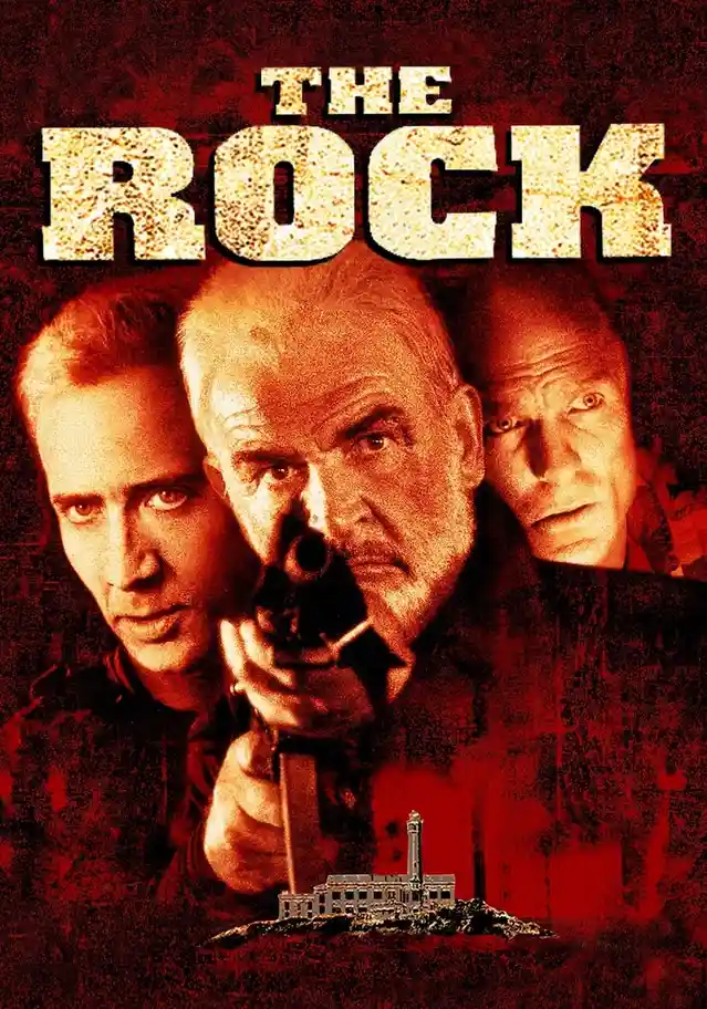The movie poster for 'The Rock' features three men with intense expressions, one holding a gun pointed forward, against a…