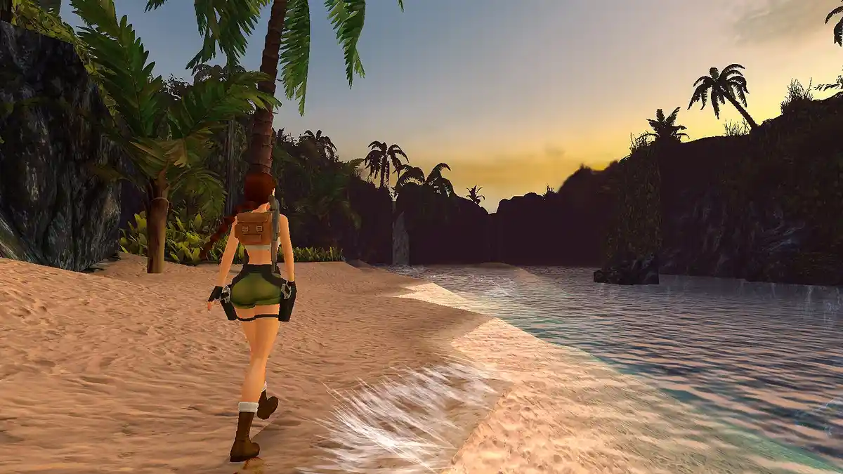 A video game character, Lara Croft from Tomb Raider, walks along a tropical beach at sunset, viewed from behind. She wears…